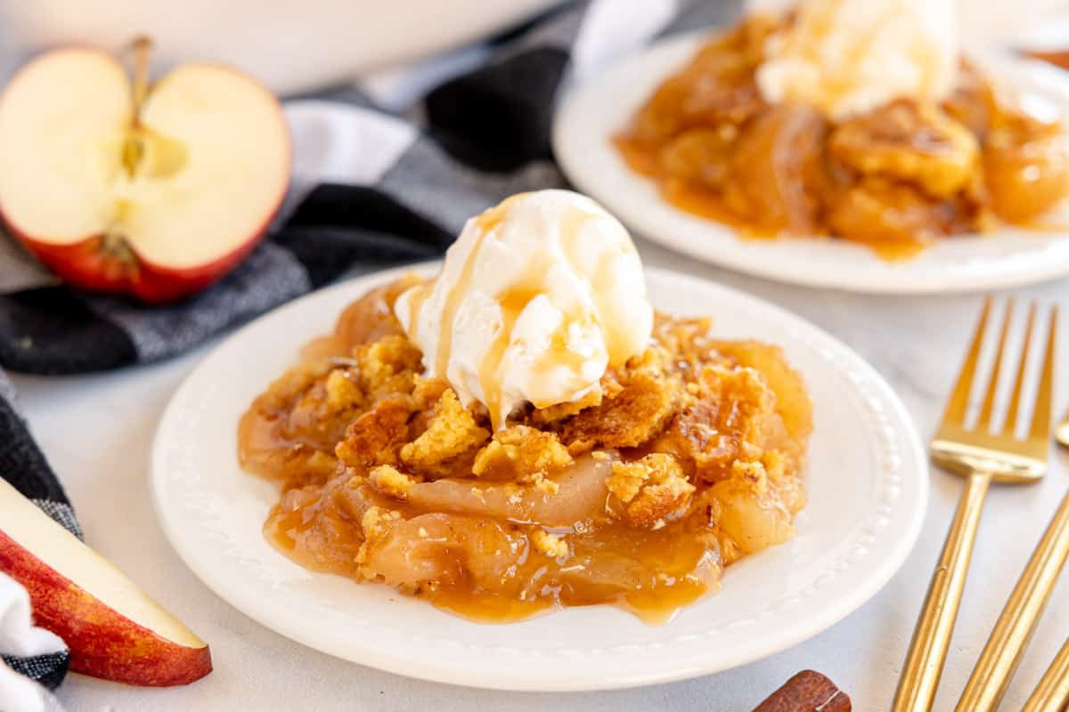 Apple dump cake with icecream on a plate.