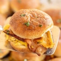 Breakfast sliders on a serving spatula.