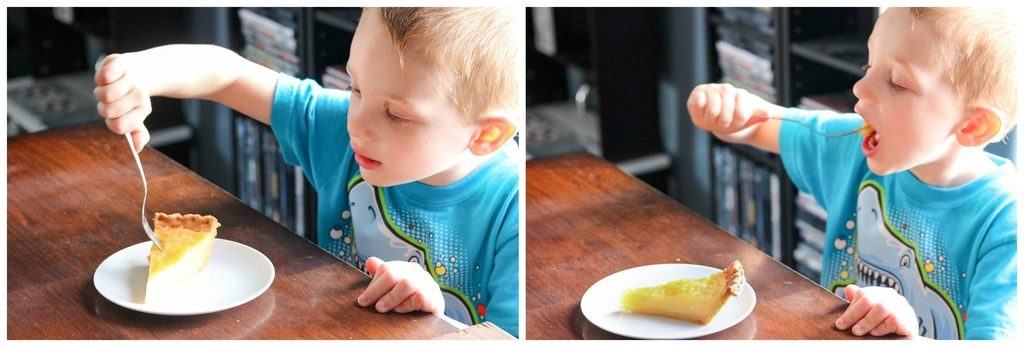A young boy eating a slice of pie on a plate