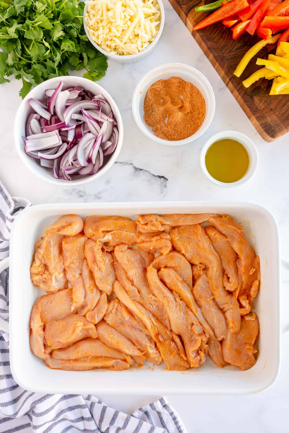 raw chicken in a casserole dish