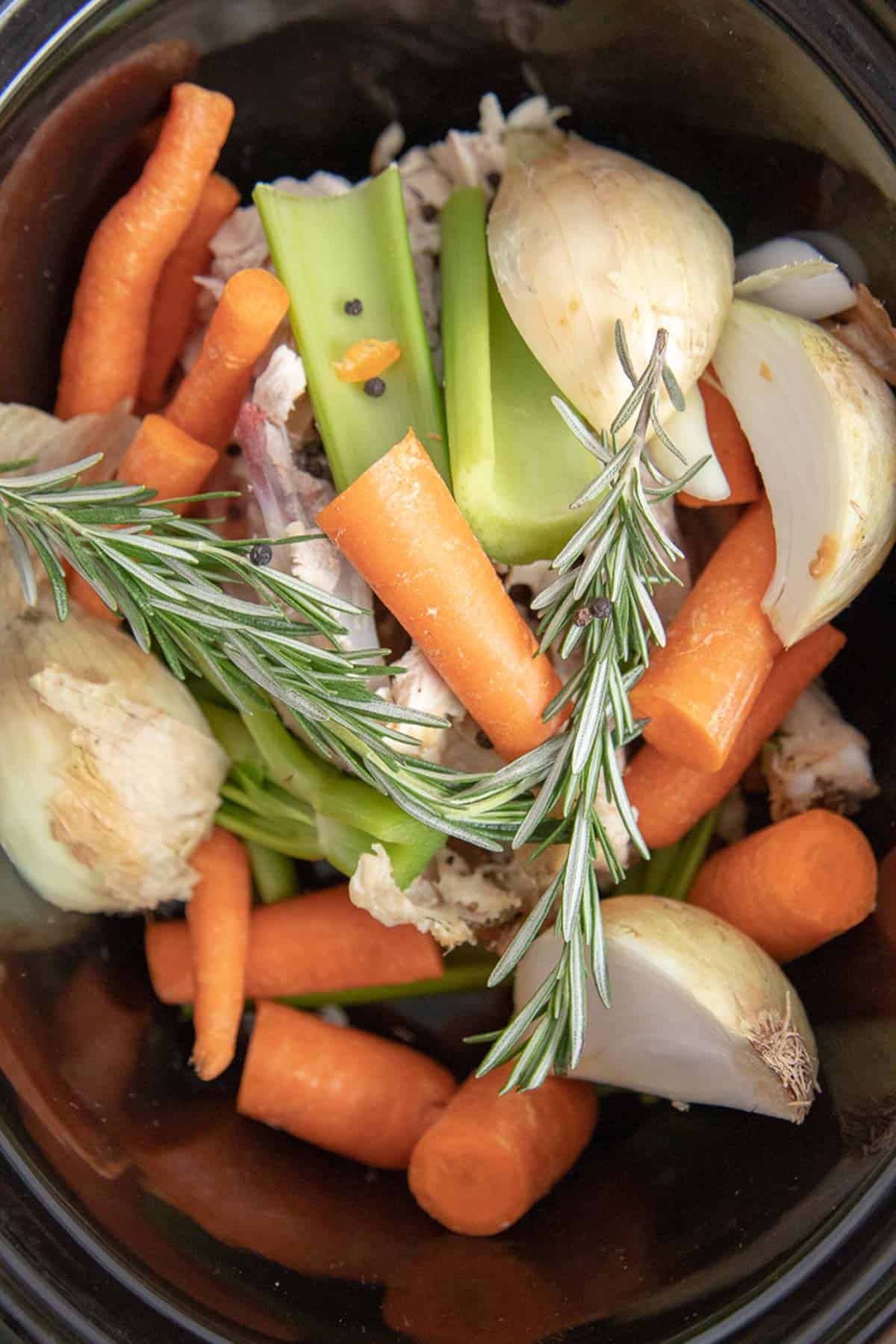 chicken stock ingredients in a crockpot