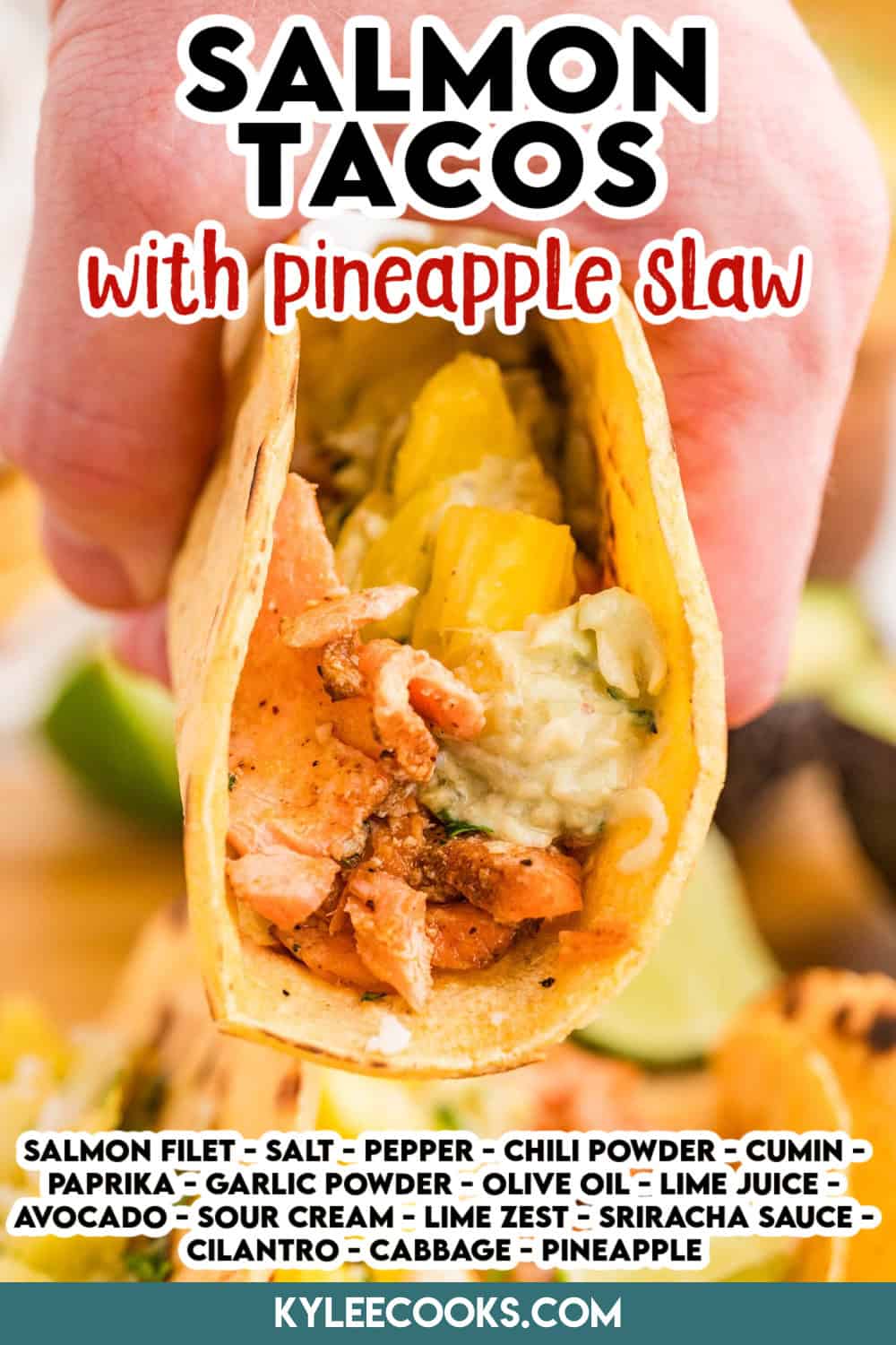 A hand holding a close-up of a salmon taco with pineapple slaw and cotija cheese. Text on the image says 'Salmon Tacos with pineapple slaw' and includes a list of ingredients.