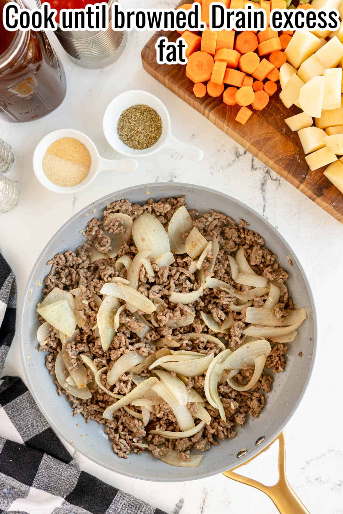 cooked beef and onions in a skillet.