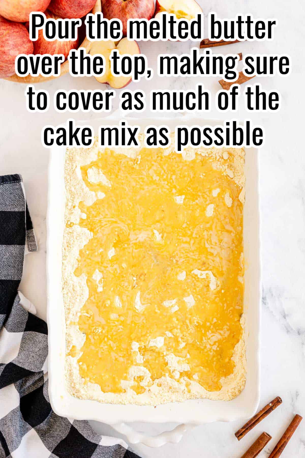 Apple Dump Cake with melted butter on top of it.