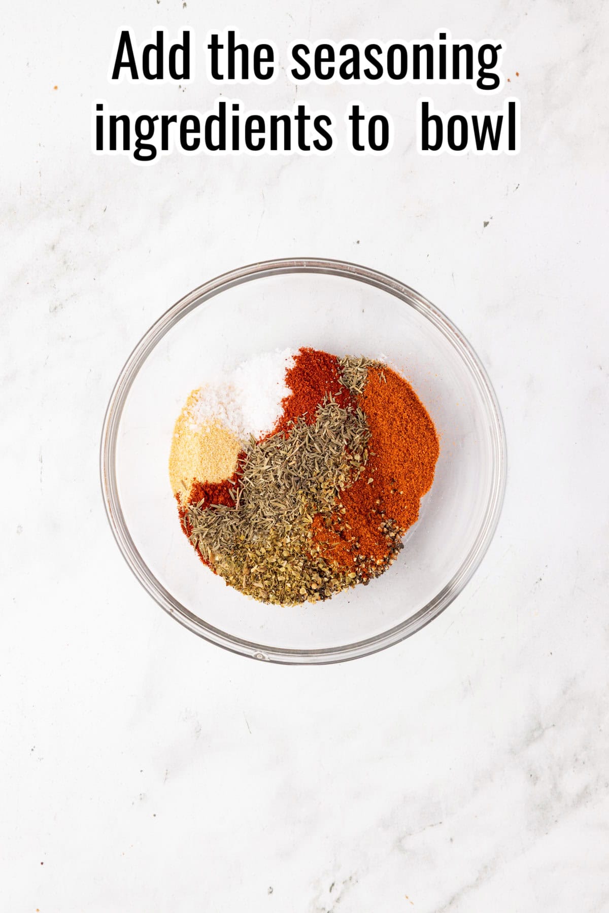 Bowl of spices arranged by color and type. Text on the image says 'Add the seasoning ingredients to bowl'.