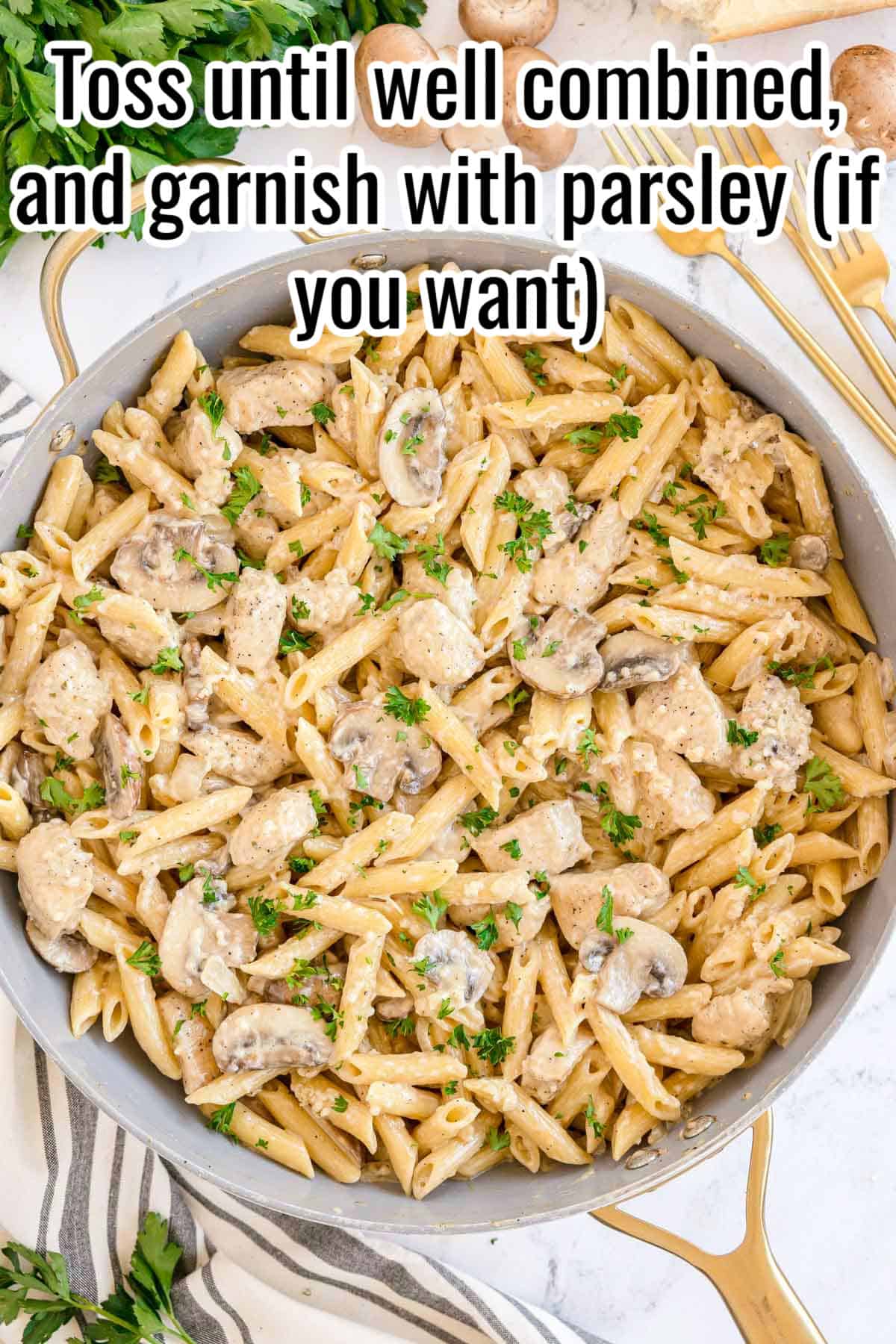 Finished creamy chicken mushroom pasta tossed with parsley. Text on the image says 'Toss until well combined, and garnish with parsley (if you want)'.