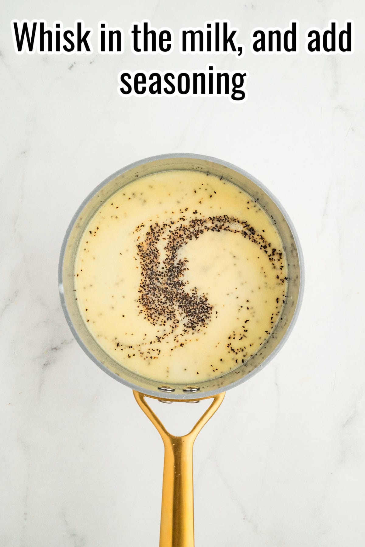 Saucepan with creamy mixture and black pepper. Text on the image says 'Whisk in the milk, and add seasoning'.