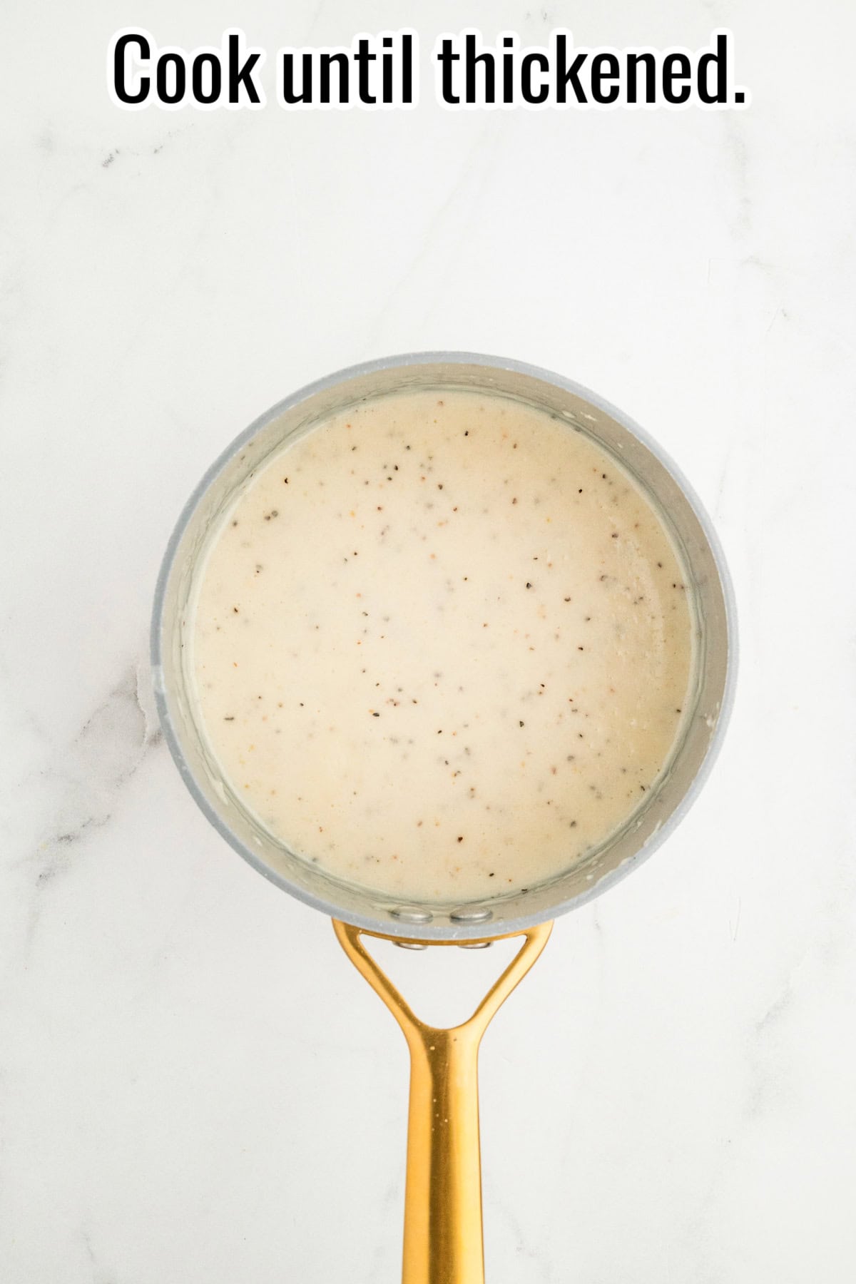 Saucepan with thickened pepper gravy. Text on the image says 'Cook until thickened'.