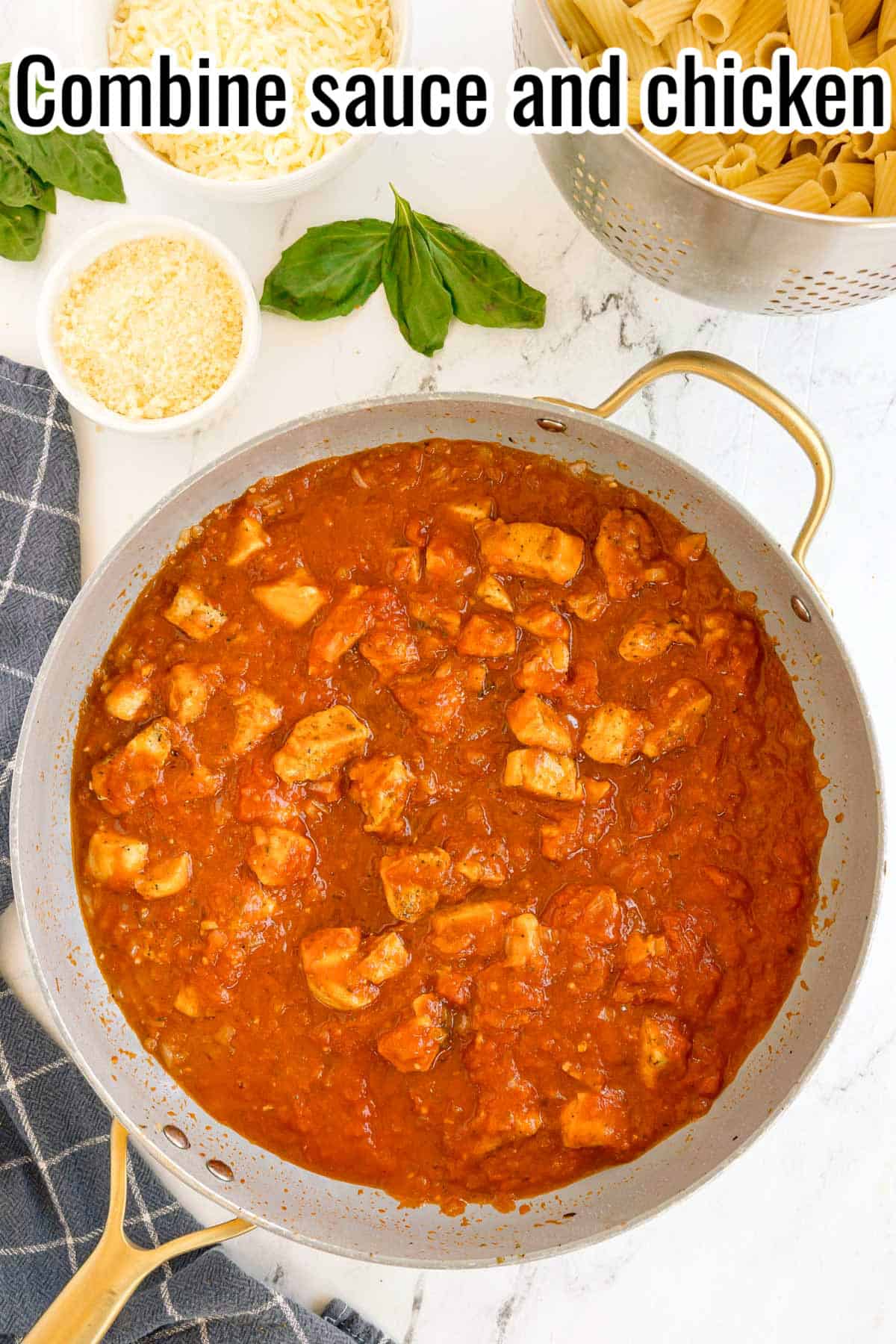 A skillet with chicken and marinara sauce. Text on the image says 'Combine sauce and chicken'.