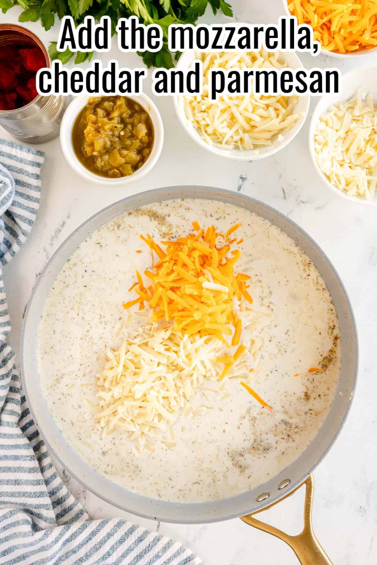 Add the mozzarella, parmesan and cheddar to the skillet.