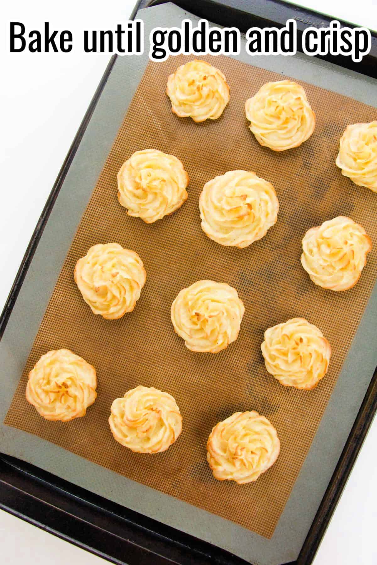 Baked duchess potatoes on a tray with golden, crisp tops. Text on the image says 'Bake until golden and crisp'.