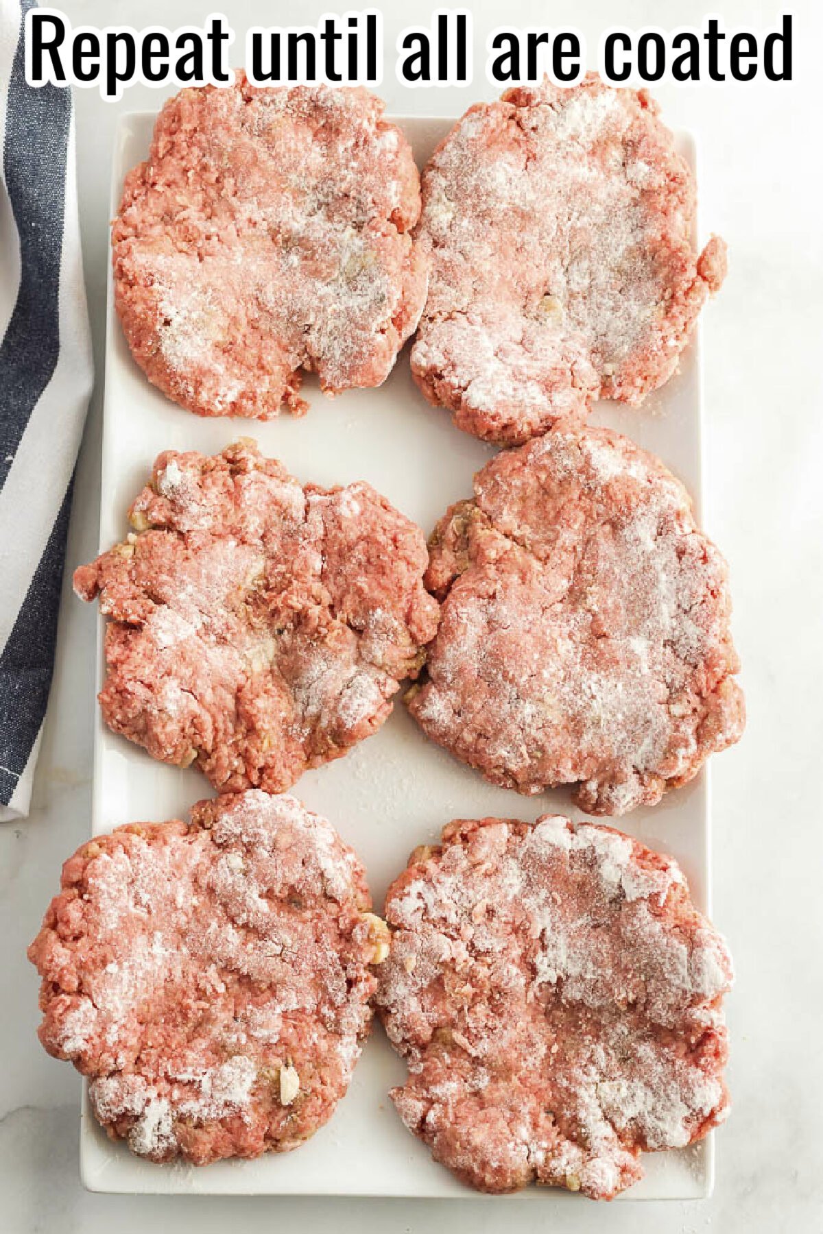 A white plate with six raw beef patties coated in flour, ready for cooking, with text overlay reading "Repeat until all are coated."
