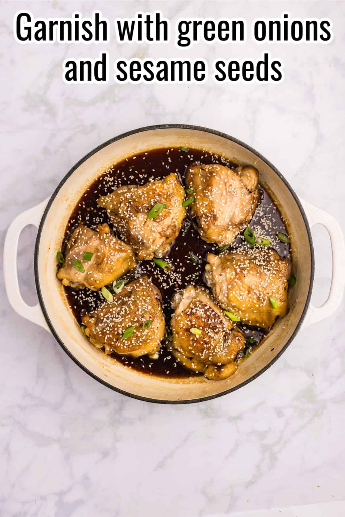Chicken thighs coated in glaze and garnished with green onions and sesame seeds. Text on the image says 'Garnish with green onions and sesame seeds'.