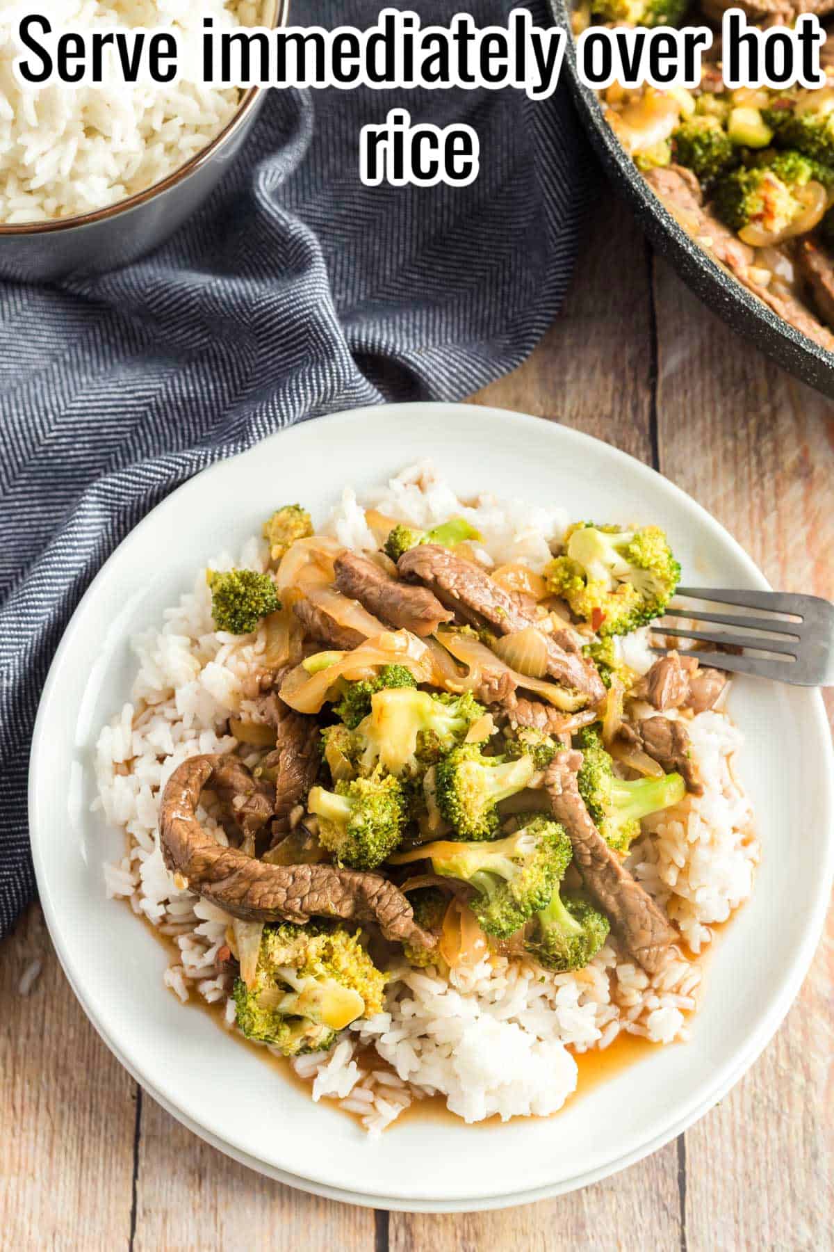 A plate of honey soy beef and broccoli served over hot rice with a fork resting on the side. Text on the image says 'Serve immediately over hot rice'.